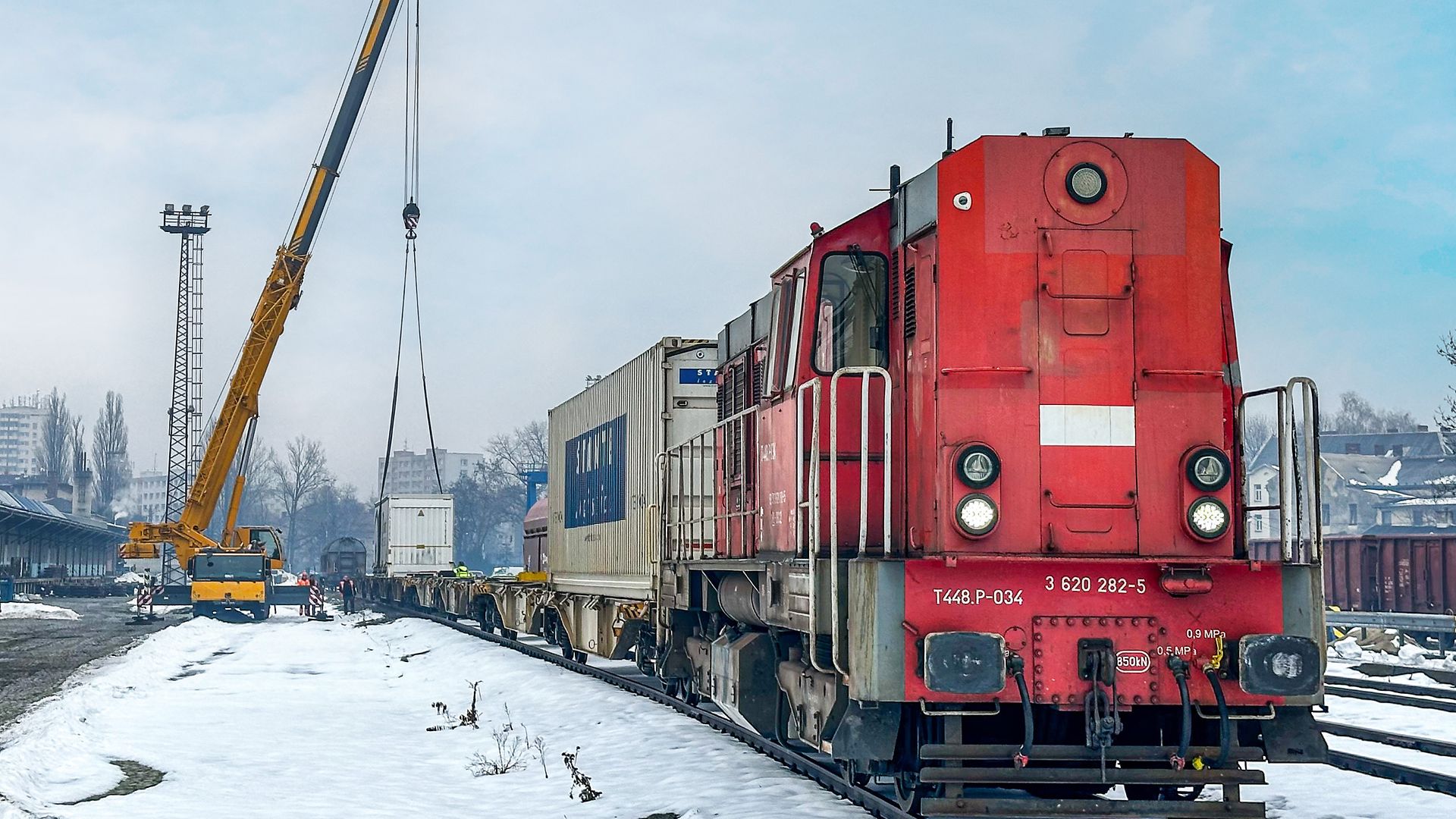 three red diesel locomotives