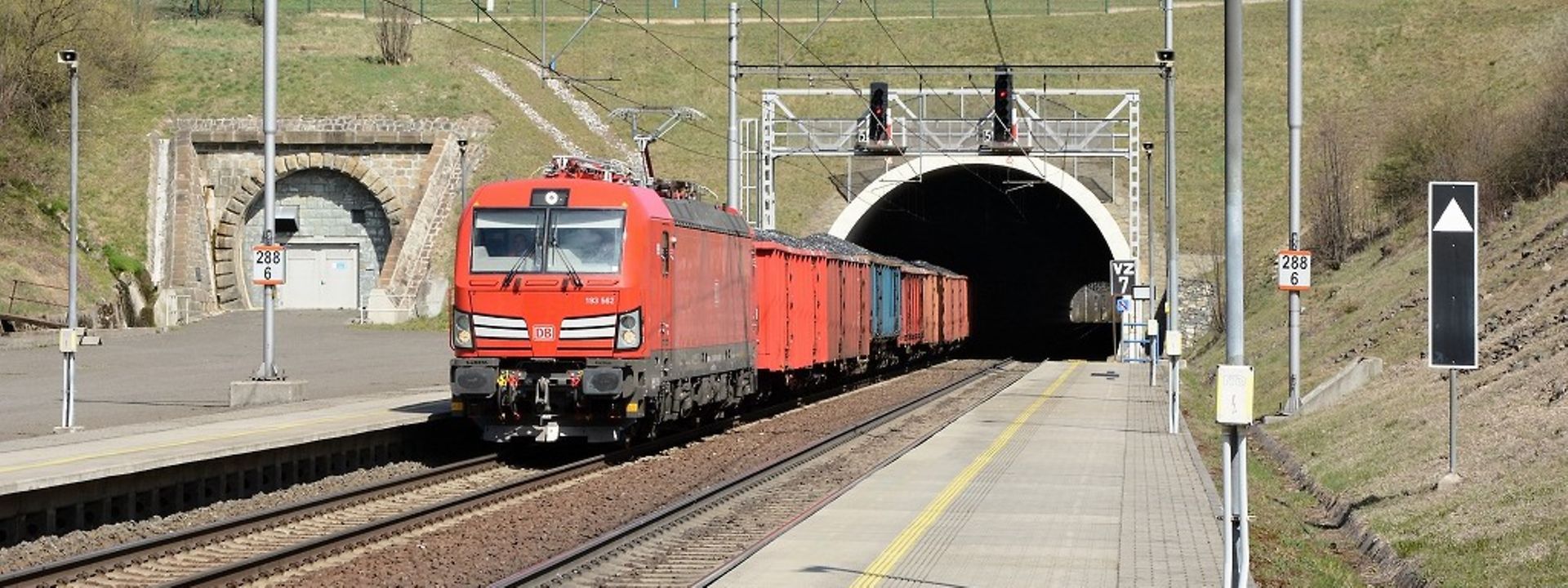 Freight wagon train in front of tunnel